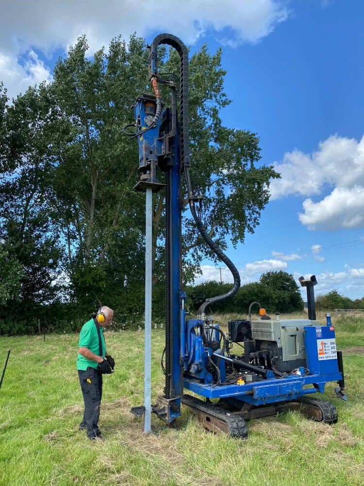 RJW Electrics team installing ground mounted solar panels