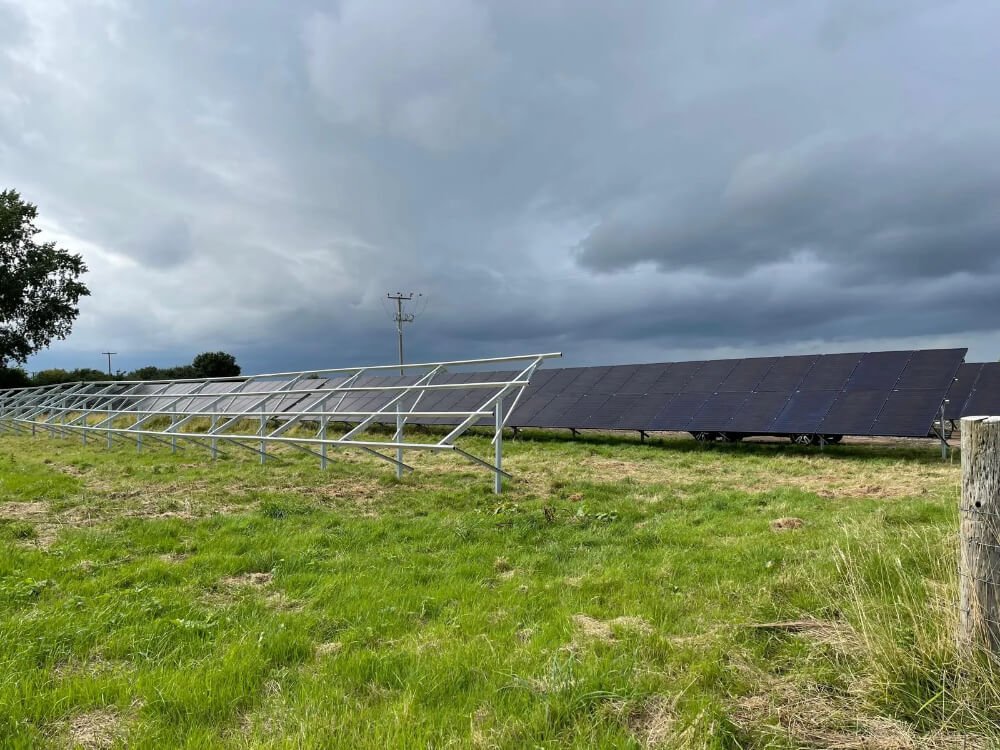 Ground mounted solar panels at industrial site